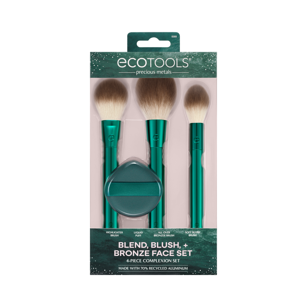 Green makeup brush set with three soft brown bristles and pointed tips