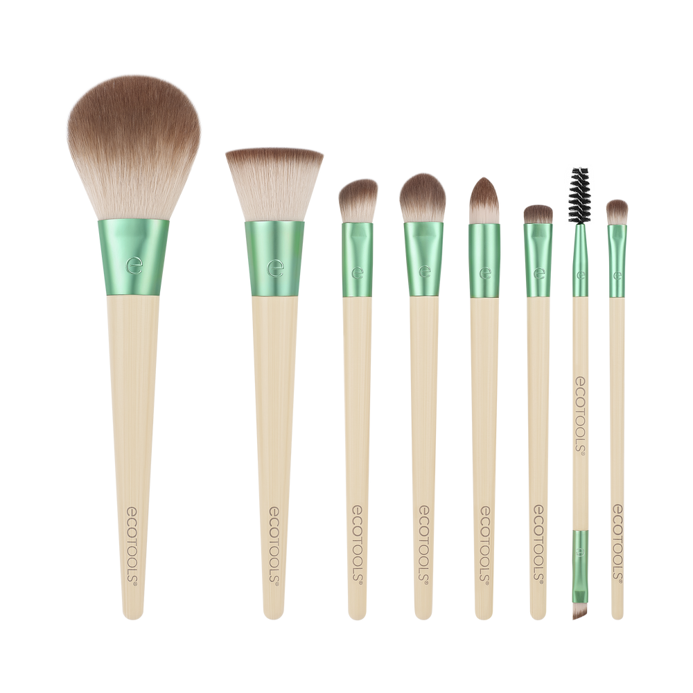 Makeup brush set with green handles and beige bristles, assorted sizes