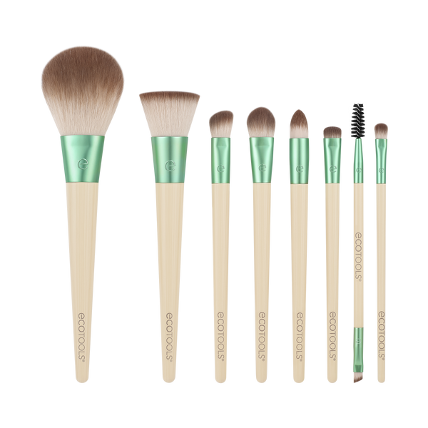 Makeup brush set with green handles and beige bristles, assorted sizes
