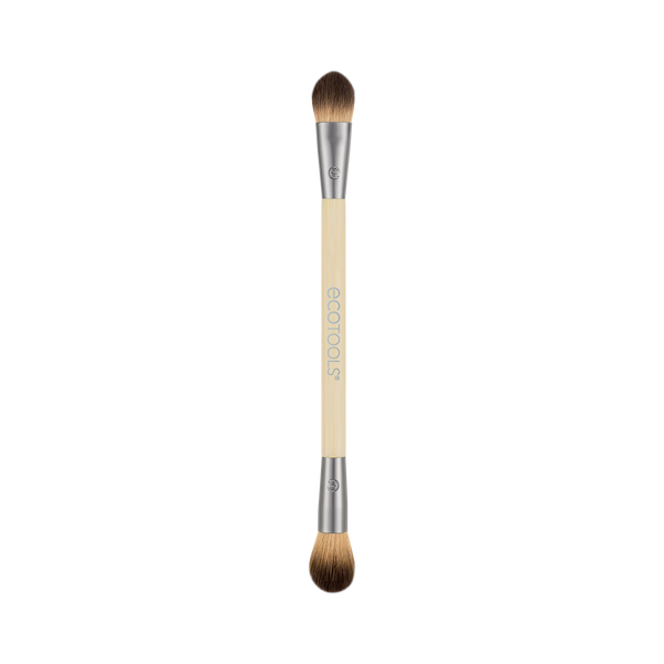 Dual-ended eye makeup brush with cream handle and brown bristles, two tapered tips.