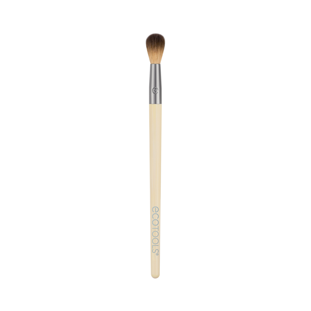 Tapered eye crease makeup brush with beige handle and dense brown bristles