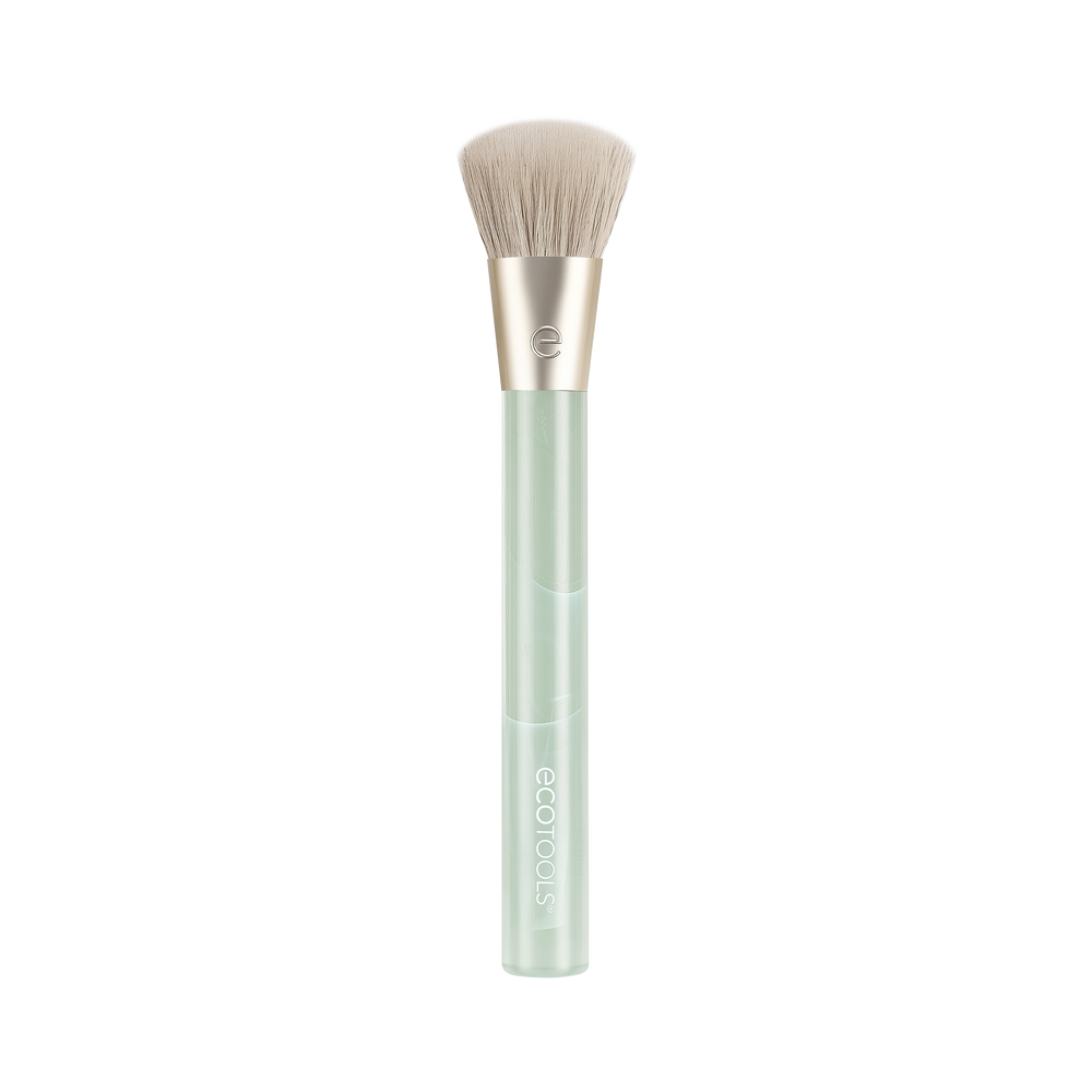 Cream blush makeup brush with soft beige bristles and light green translucent handle