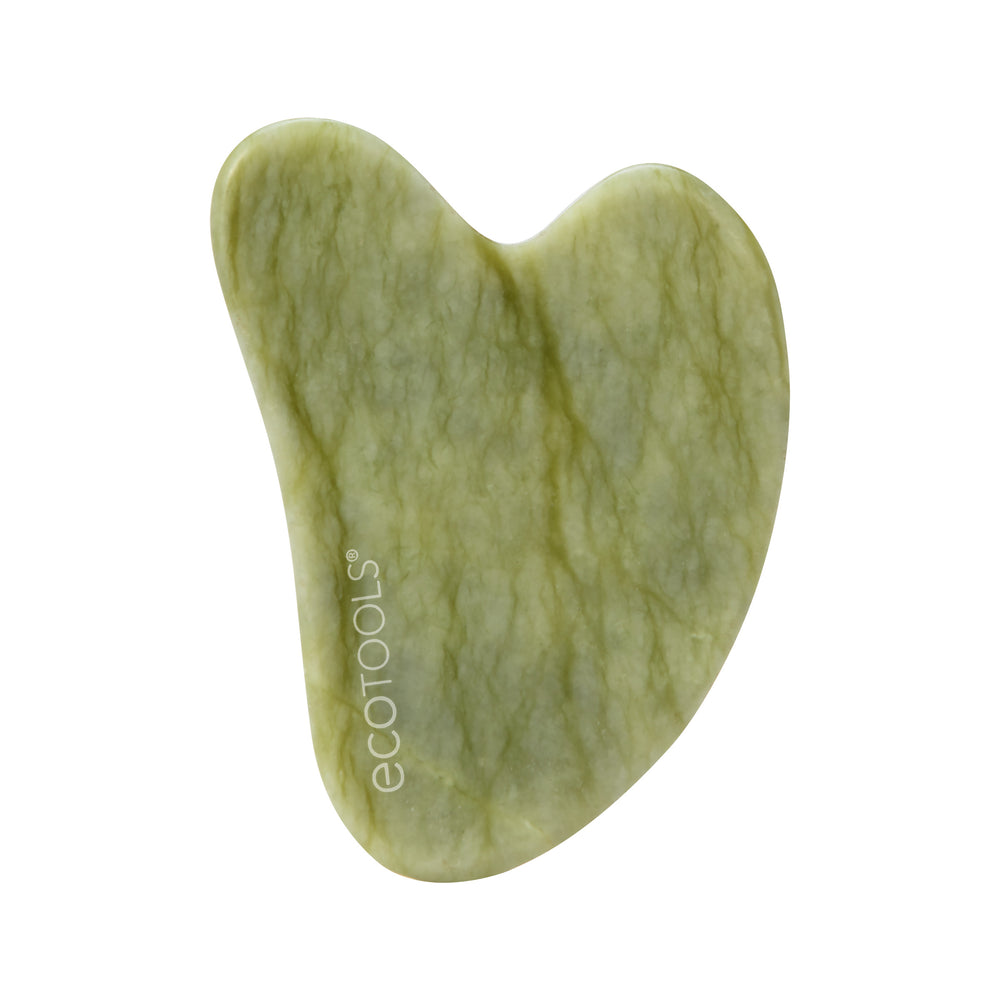 Heart-shaped jade gua sha tool, light green stone with swirled texture