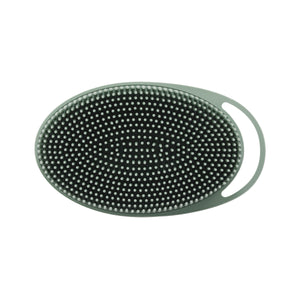 Sage green oval silicone body scrubber with dense round dot bristles