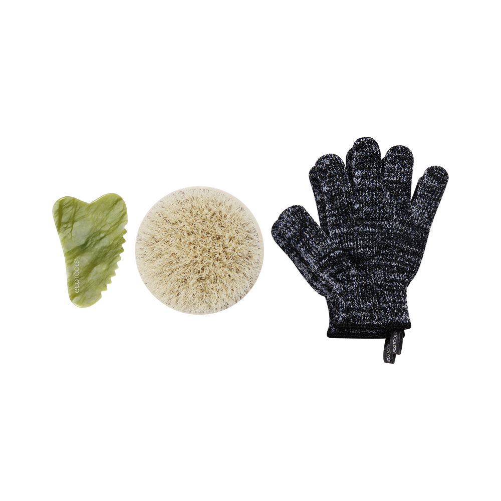 Exfoliating tool set: green gua sha, beige body brush, dark scrub gloves