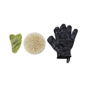 Exfoliating tool set: green gua sha, beige body brush, dark scrub gloves