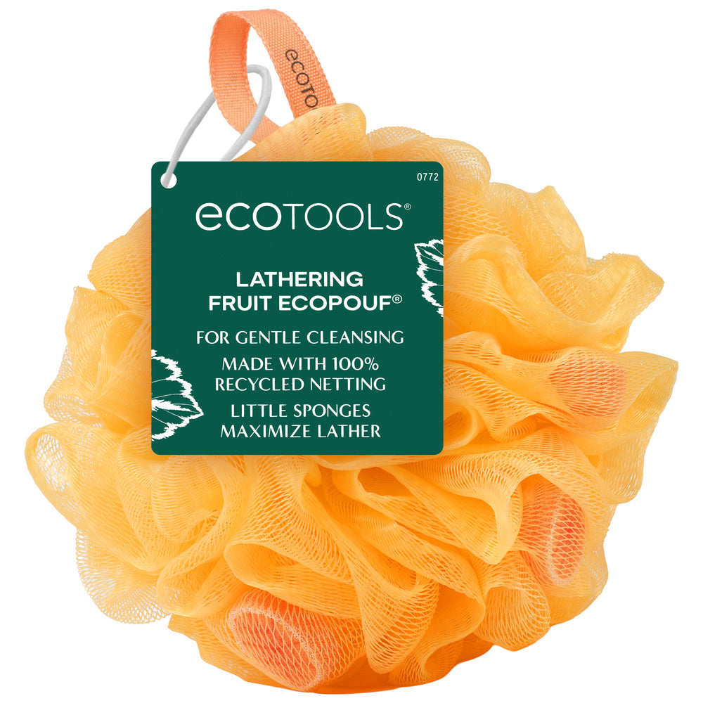 Orange lathering bath sponge with ECOTOOLS hanging tag, fruit-flower mesh.
