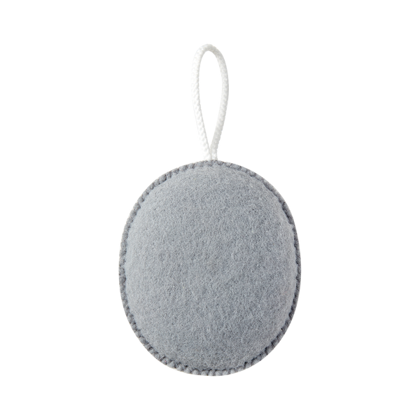 Grey oval exfoliating puff with hanging cord, textured scrubbing surface