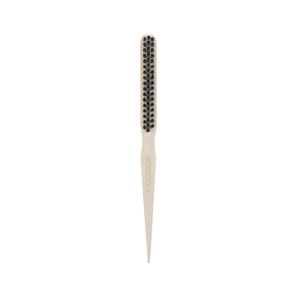Slick back brush top view with small rounded black bristle tips on cream base