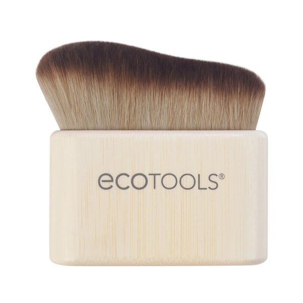 Self-tan blending brush with angled dark bristles and light bamboo handle, ECOTOOLS logo