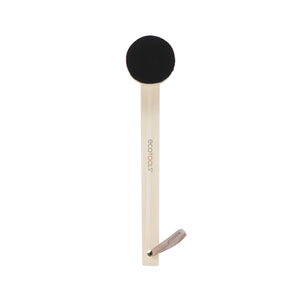 Self-tan back applicator with round black brush head and light wood handle