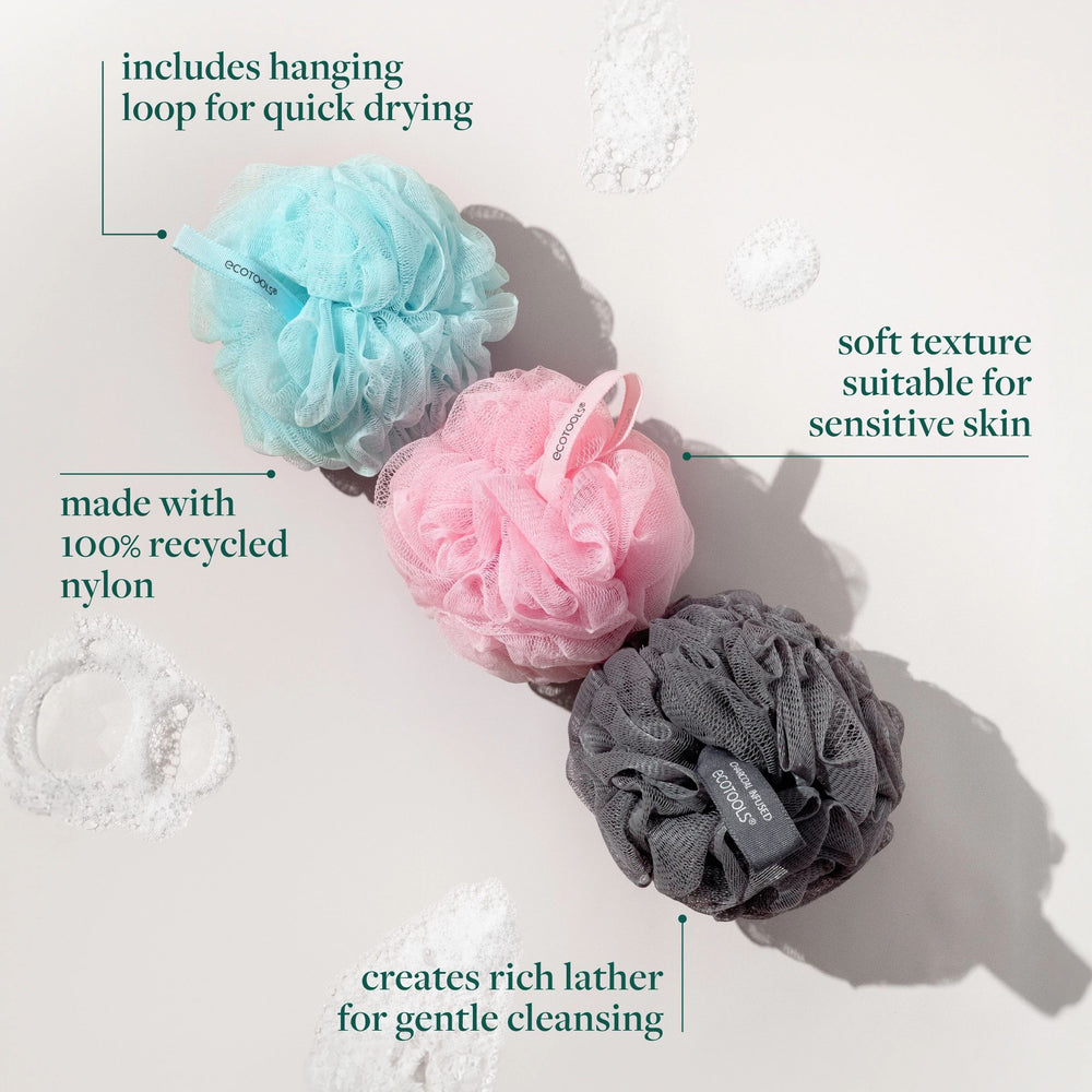 Pink mesh bath sponge with red-and-white hanging loop
