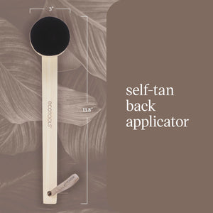 Wooden self-tan back applicator with round dark brush head and long handle