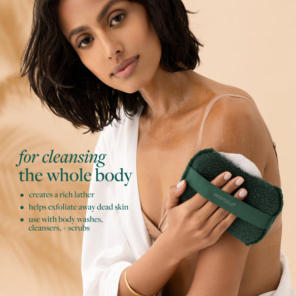 Dark green XL Body Buffer scrub held against the shoulder