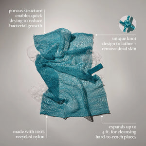 Teal exfoliating bath net with hang loop and scrub mesh, featuring teal tag