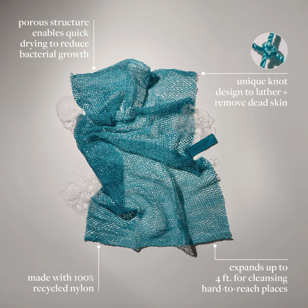 Teal exfoliating bath net with hang loop and scrub mesh, featuring teal tag