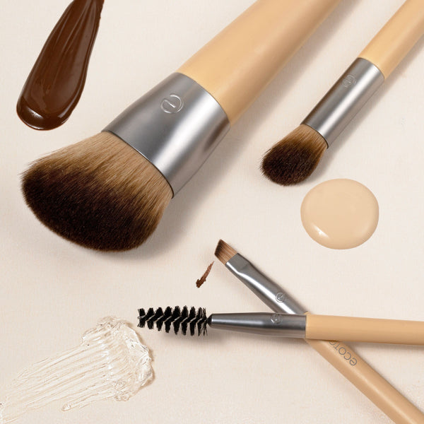 Makeup brush trio with foundation and brow brushes plus a concealer shade swatch