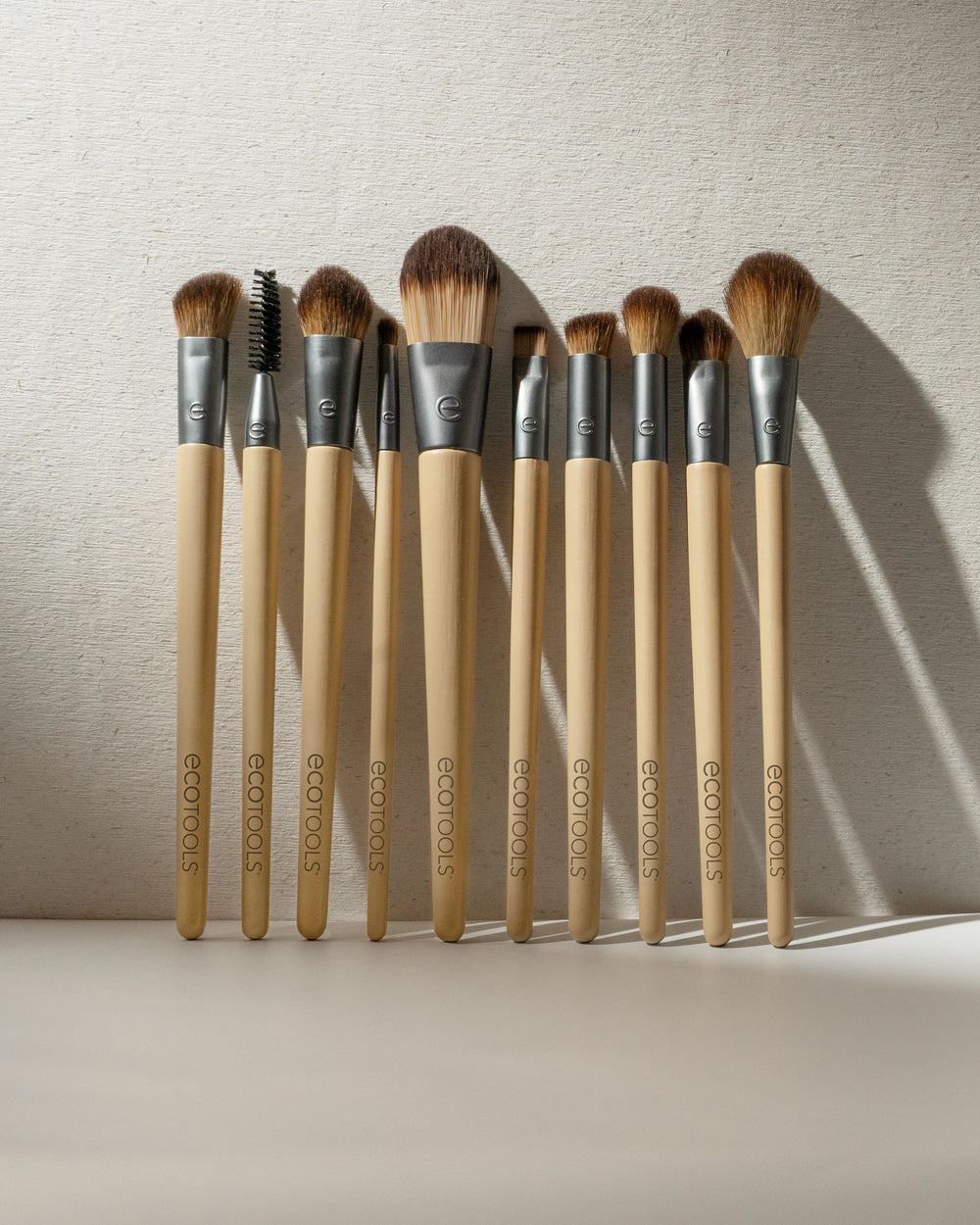 10-piece makeup brush set with wooden handles and soft brown bristles
