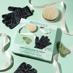 Ecotools glow kit box with black shower gloves, brush, and gua sha tools