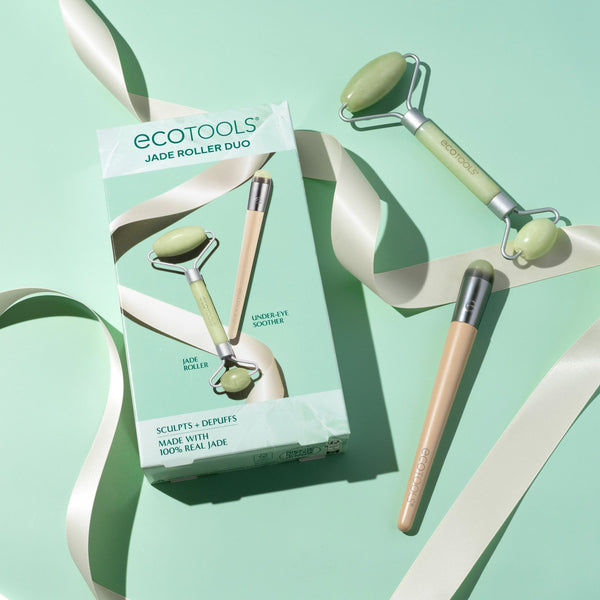 Jade face roller set with two light green stone heads and metal frames