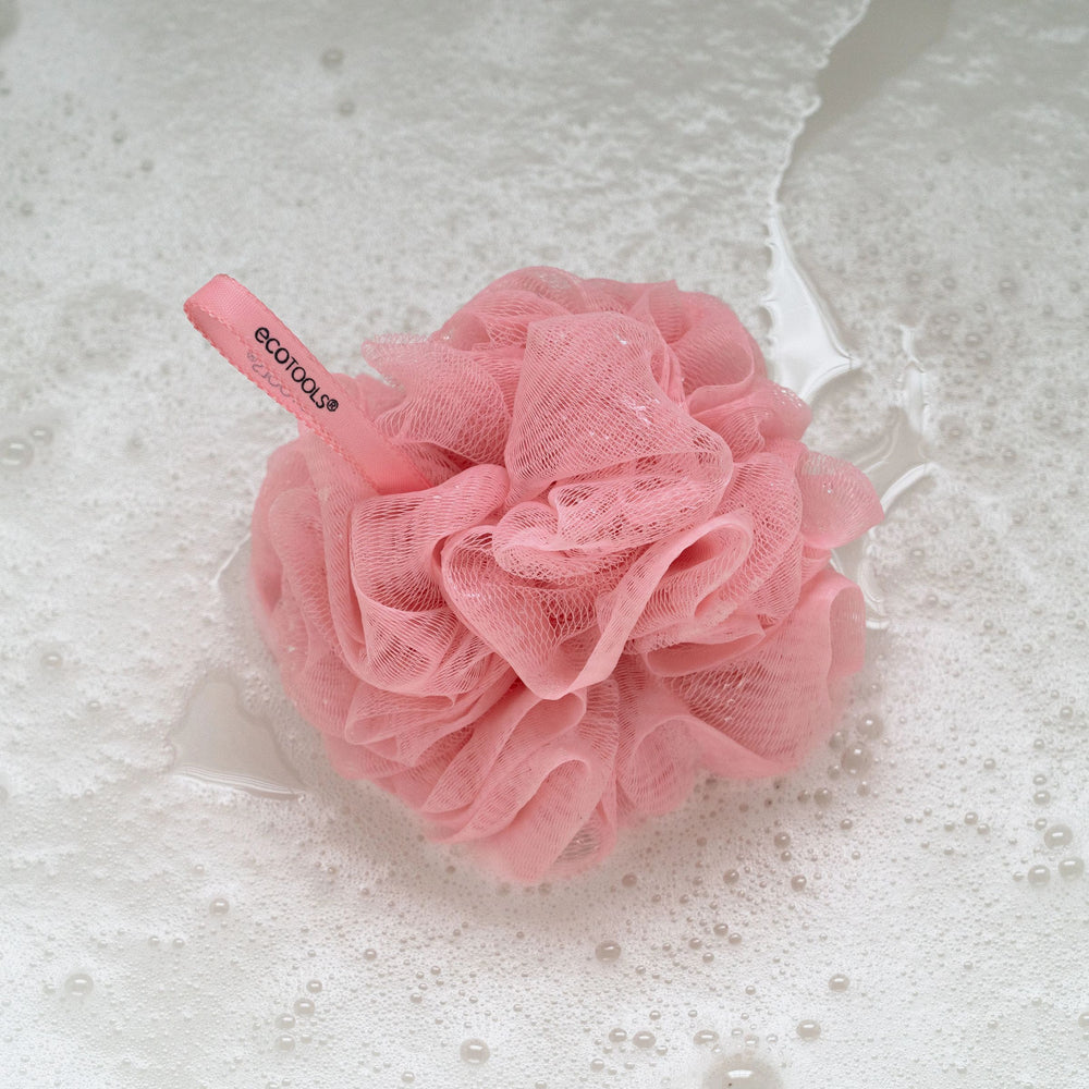 Delicate EcoPouf pink mesh cleansing puff with hanging product label