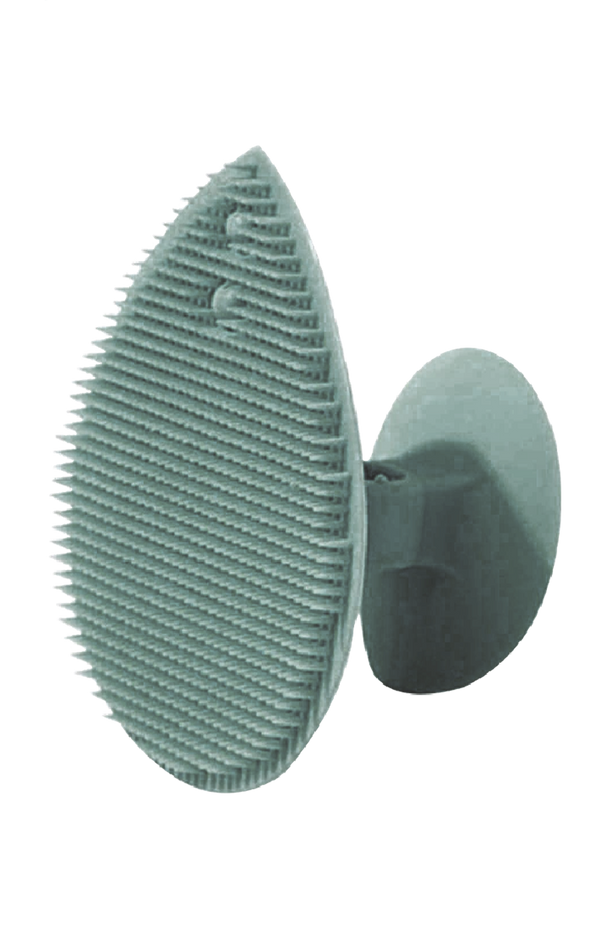 Light gray silicone facial scrubber pad with ridged texture, round shape