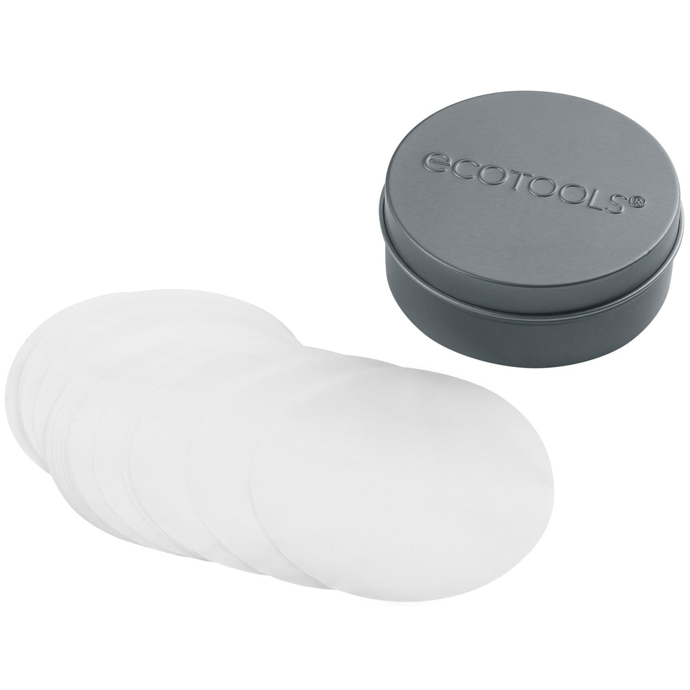 Stack of white dissolvable cleansing sheets with gray EcoTools tin lid