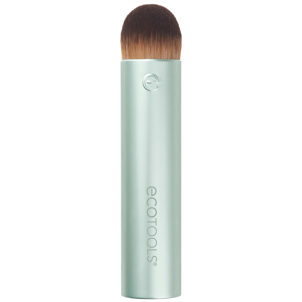Domed blending makeup brush with dense brown bristles on a light mint tube handle