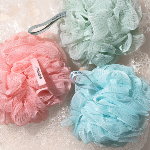 Green recycled mesh bath pouf with hanging loop and soft rosette shape