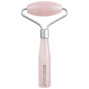 Mini rose quartz facial roller with pink stone head and silver metal handle.