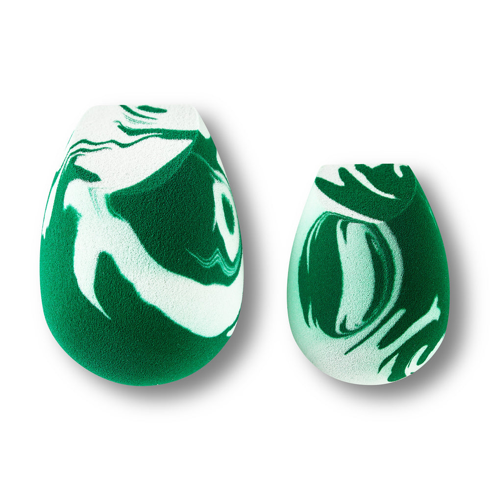 Teardrop facial sponge duo in green-and-white marble pattern.
