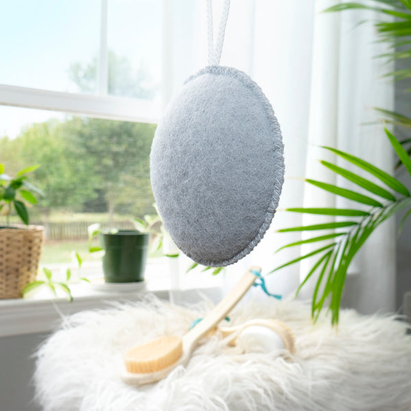 Charcoal exfoliating puff, grey oval scrubbing pad with hanging loop
