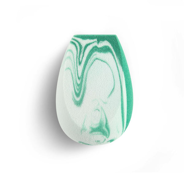 Teardrop blending sponge with white foam and green swirled pattern on surface.