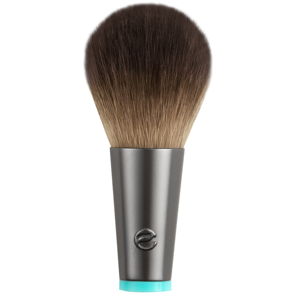 Interchangeable cheek brush head with rounded brown bristles, gray base, teal collar