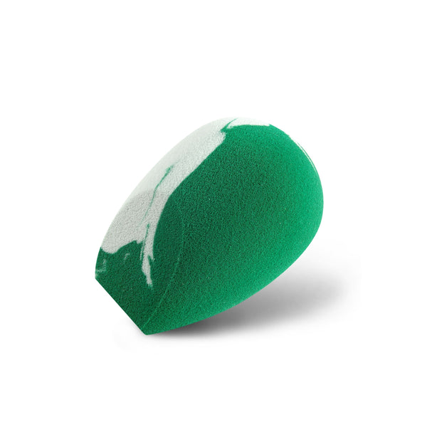 Teardrop foam sponge with green top and white side, swirled pattern texture.